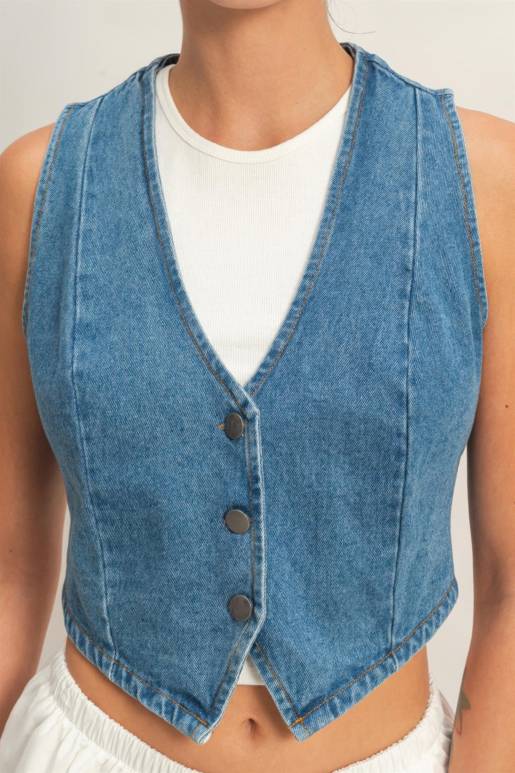 Washed Indigo Denim Button-Front Cropped Vest over a white top