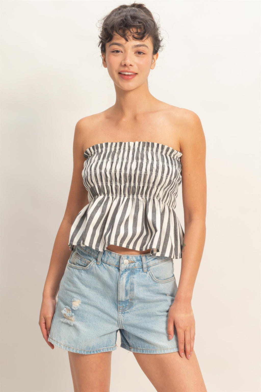 Ivory Ink Stripe Smocked Peplum Strapless Top with light wash denim shorts