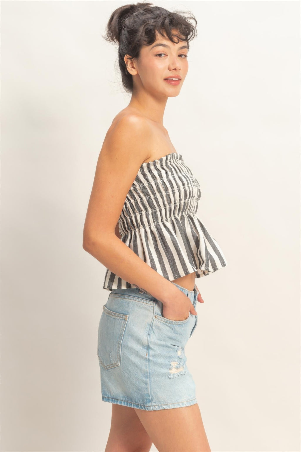 Ivory Ink Stripe Smocked Peplum Strapless Top with light blue denim shorts