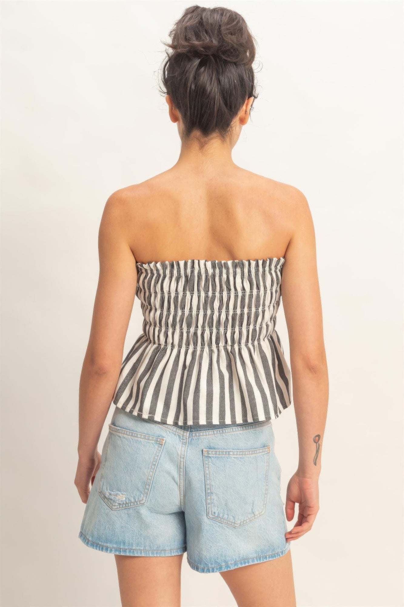 Ivory Ink Stripe Smocked Peplum Strapless Top with light wash denim shorts