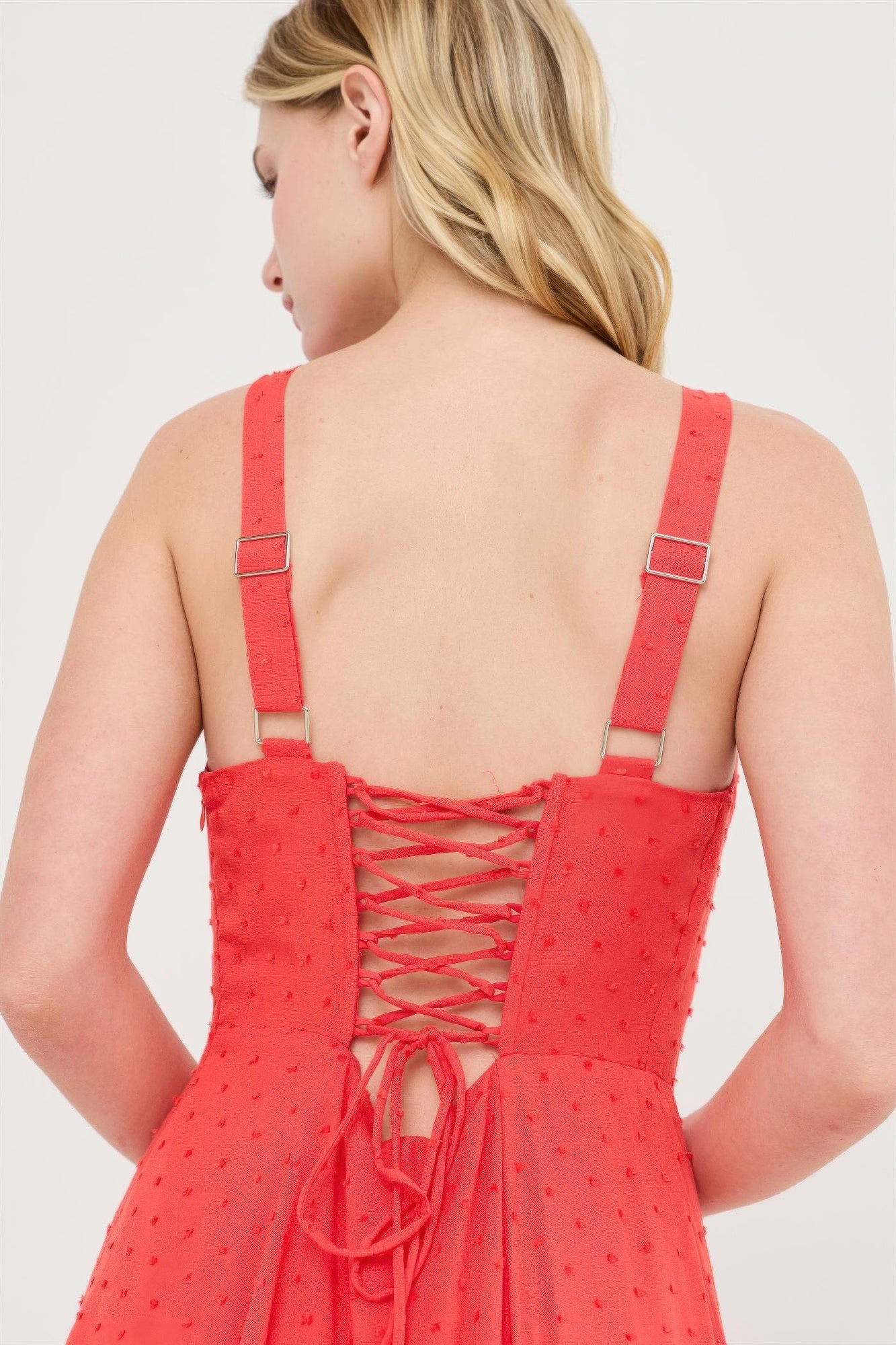 Back view of Coral Flame Ruched-Bust Slit Maxi Dress with lace-up detail and adjustable straps