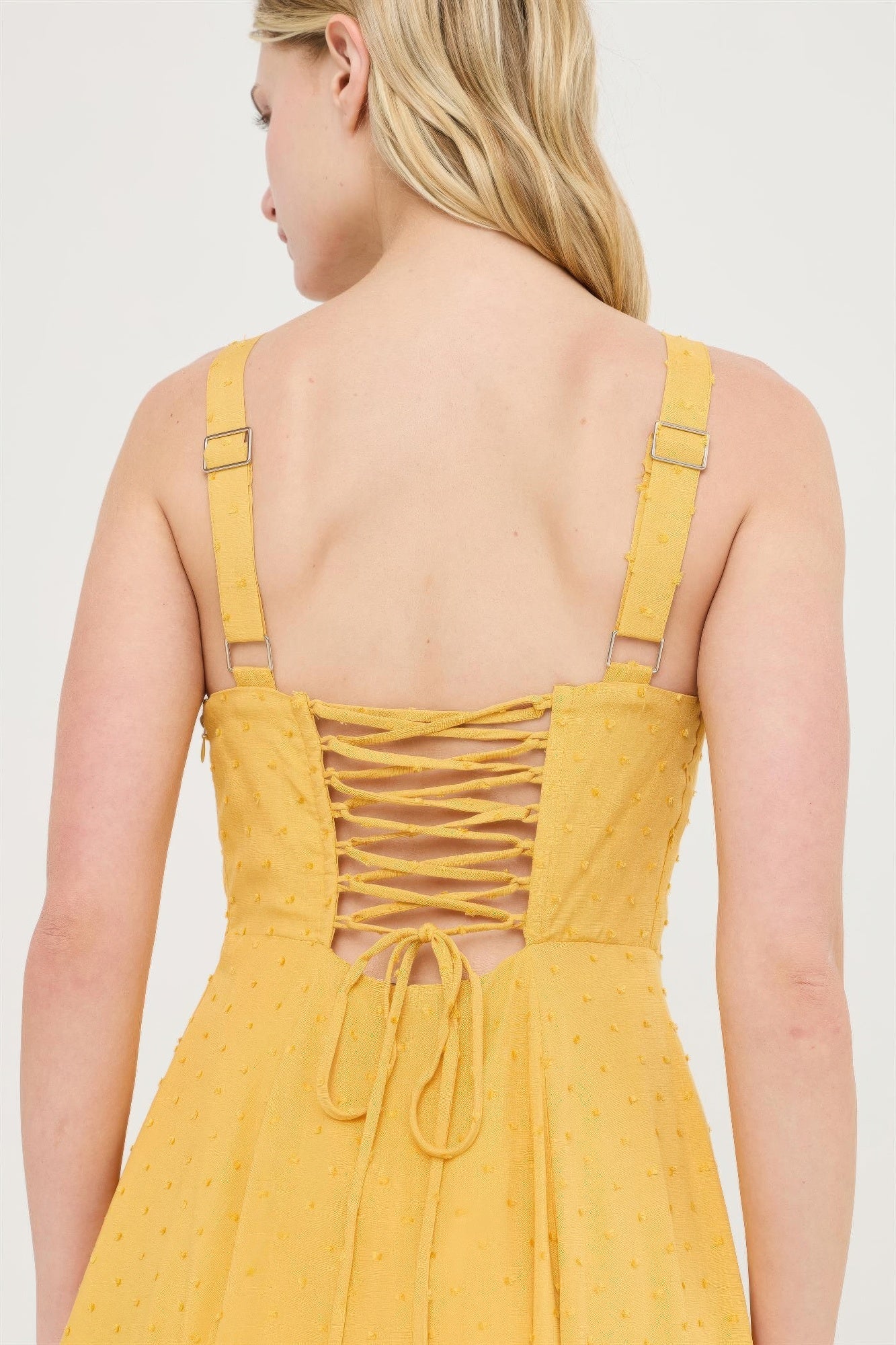 Back view of Sunlit Marigold Ruched-Bust Slit Maxi Dress with lace-up detail
