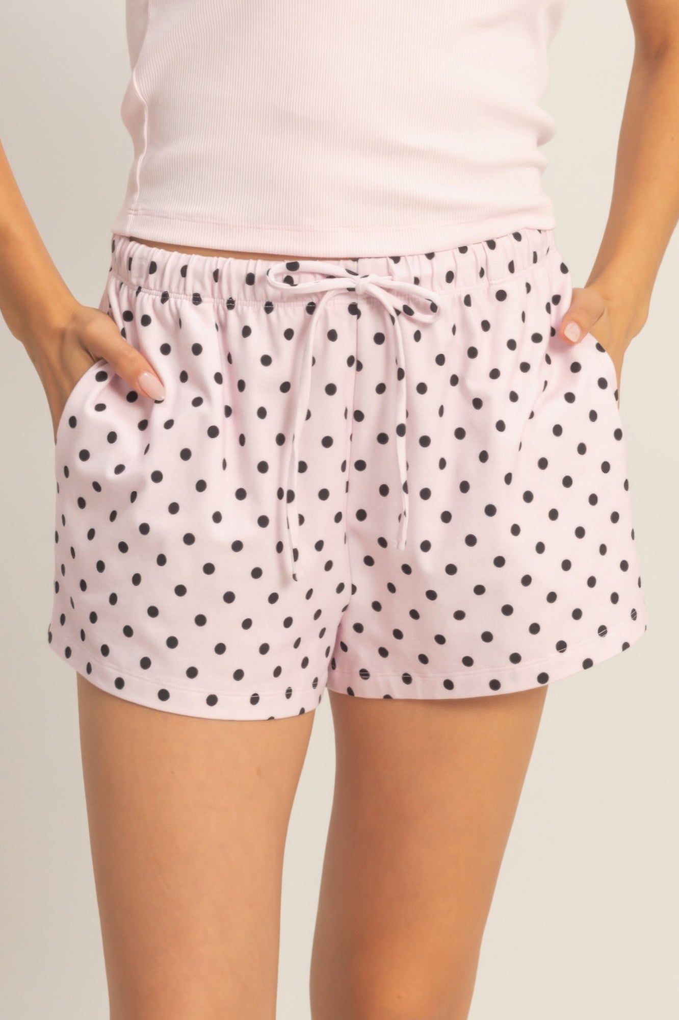 Blush Porcelain Polka Dot Drawstring Shorts with black polka dots and a drawstring waist