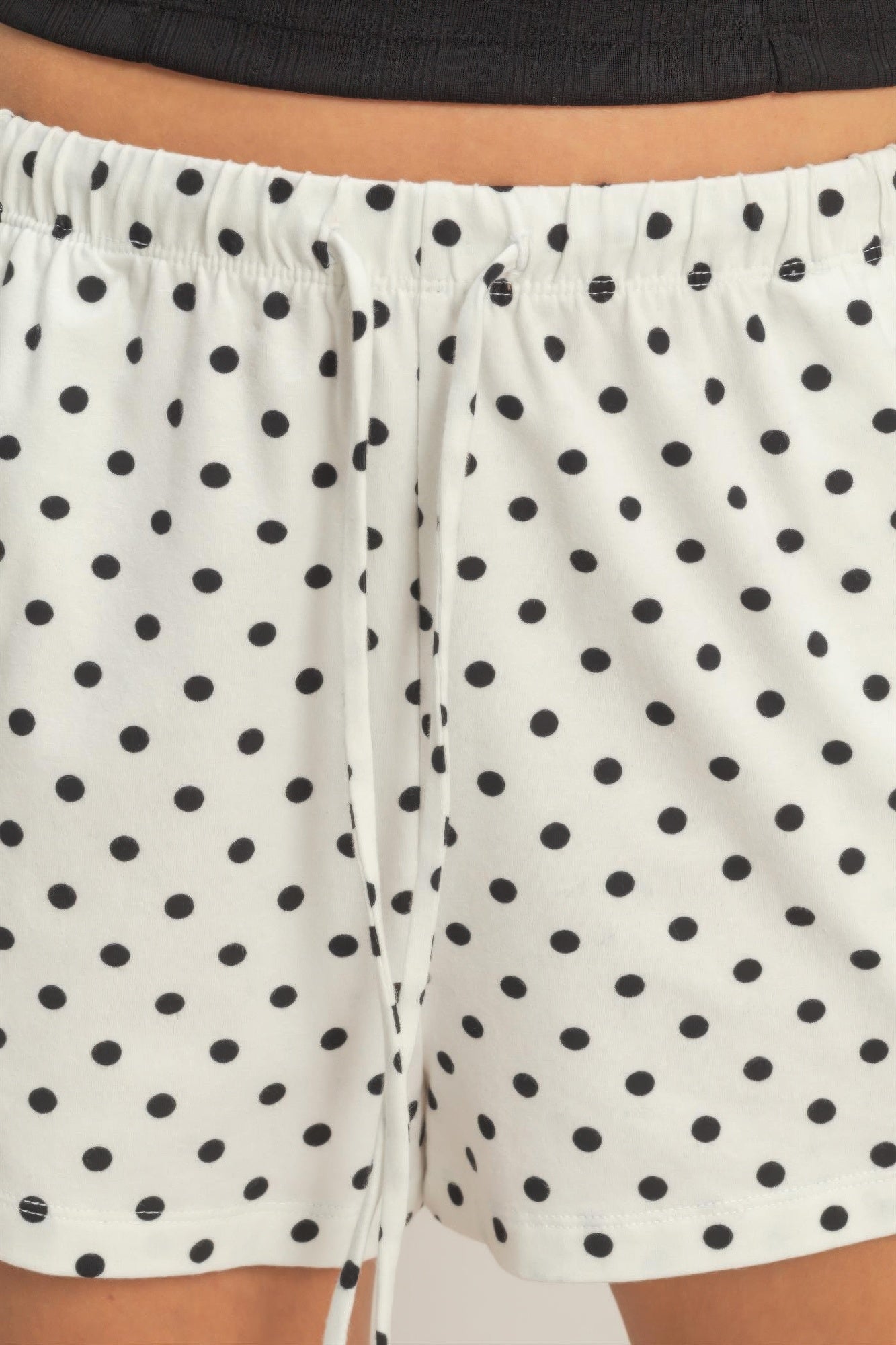 Porcelain White Polka Dot Drawstring Shorts with black polka dots and a white drawstring