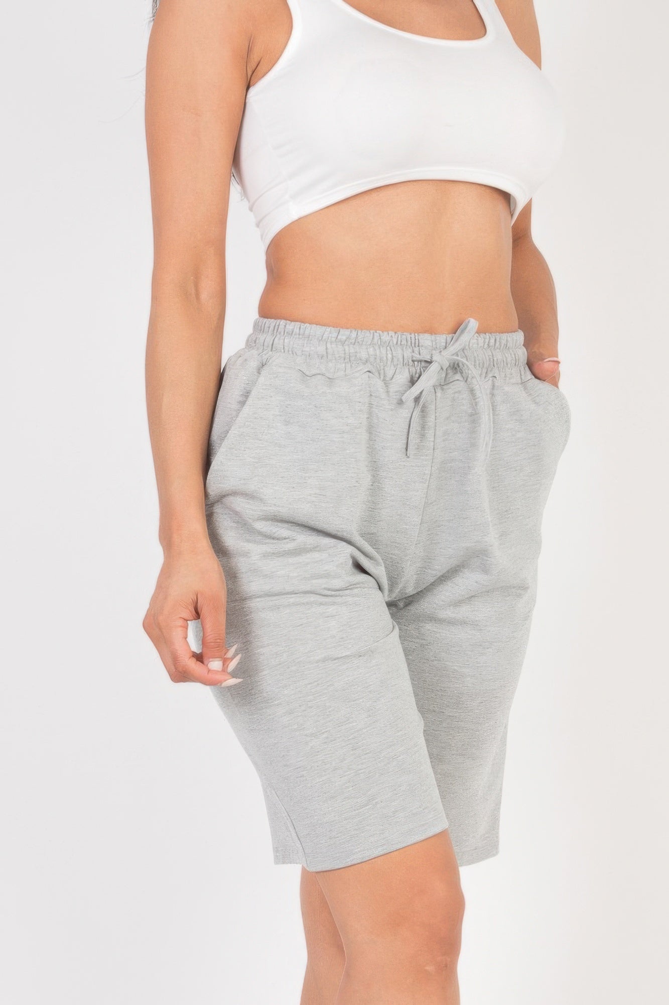 Smocked-Waist Bermuda Shorts in light grey with a white sports bra