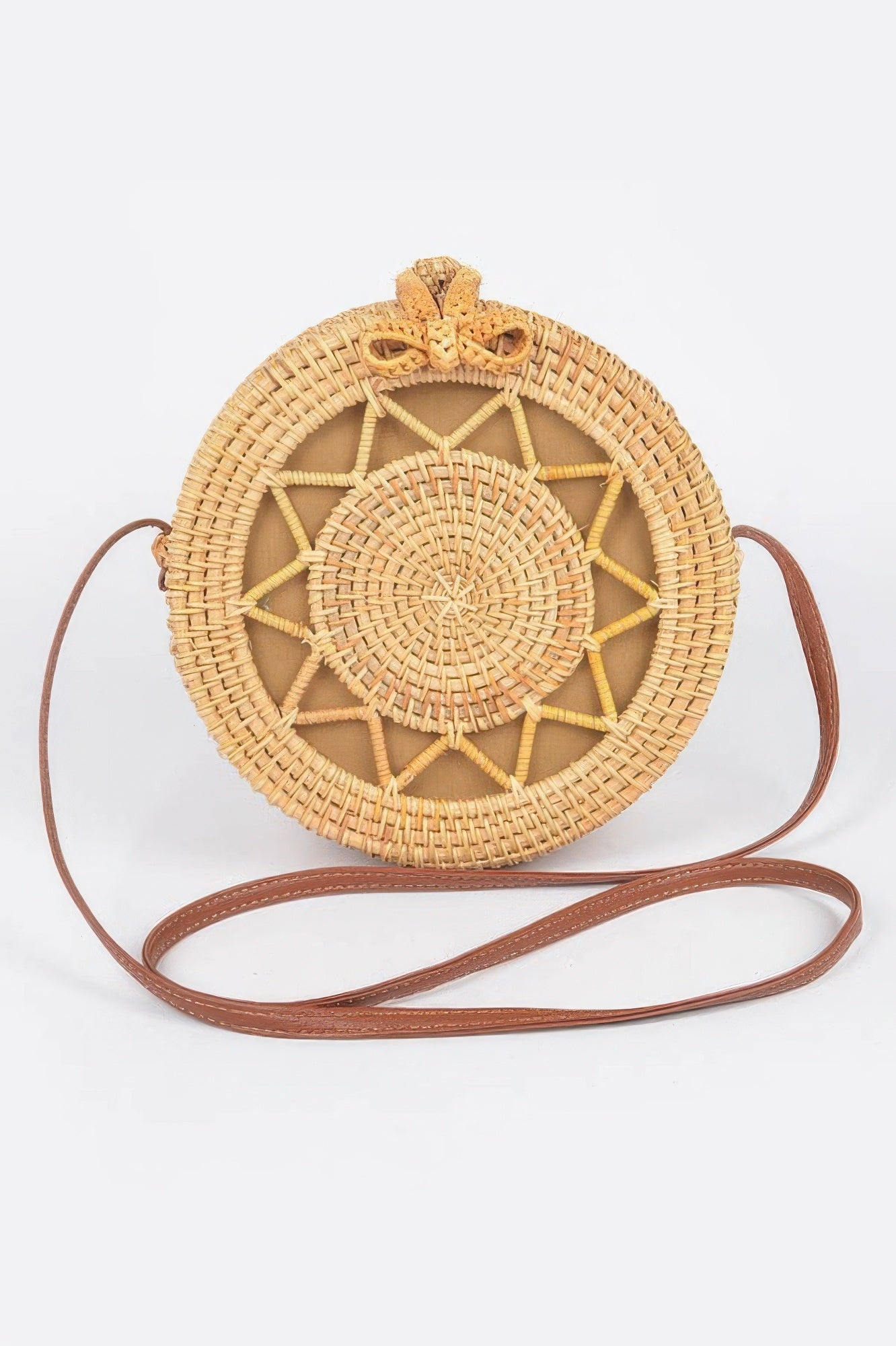 Bamboo Round Crossbody Bag with a brown leather strap and a woven star pattern on the front