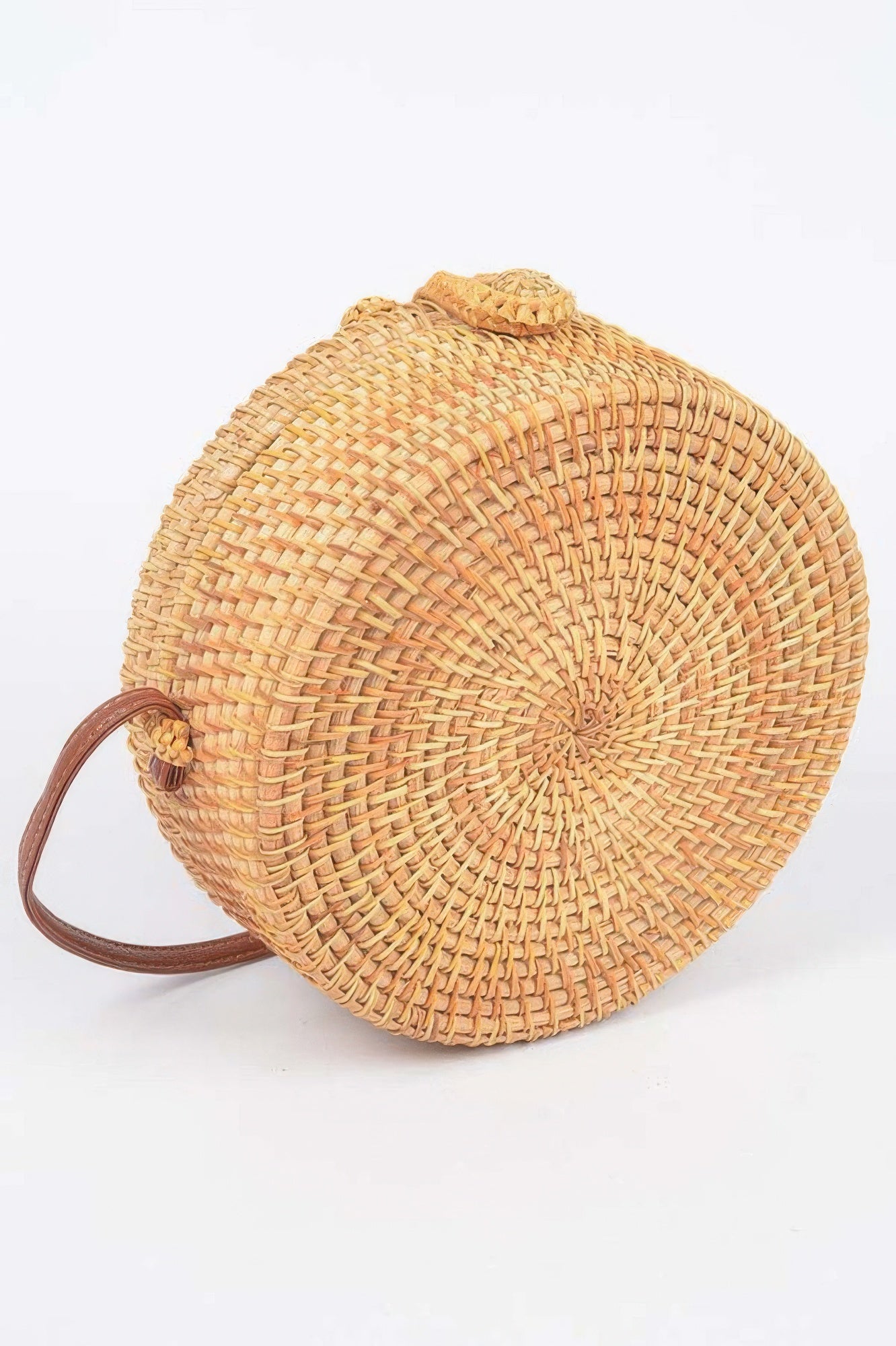 Bamboo Round Crossbody Bag with a brown leather strap and a woven pattern
