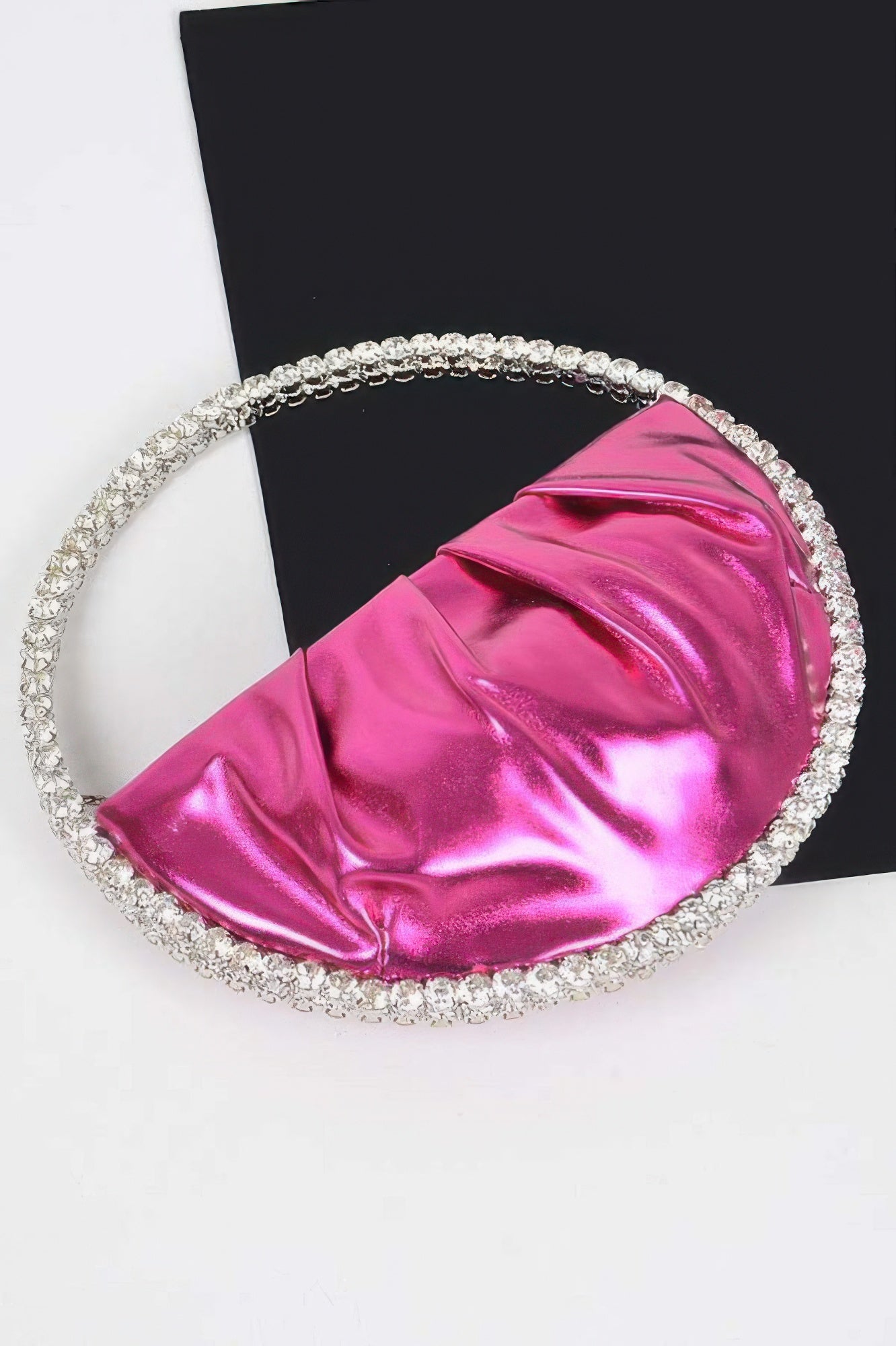 Metallic Luna Bag with stone handle, bright pink, on a black and white background
