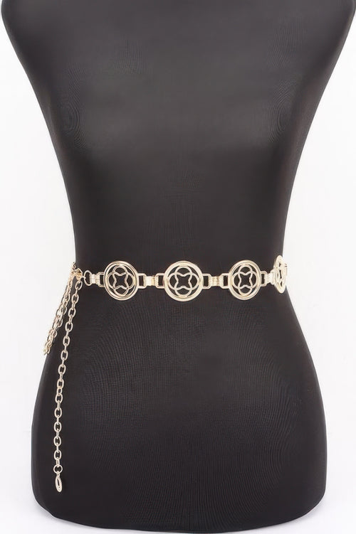 Chain Belt with gold-toned metal, circular ornaments, and dangling chains on a black mannequin