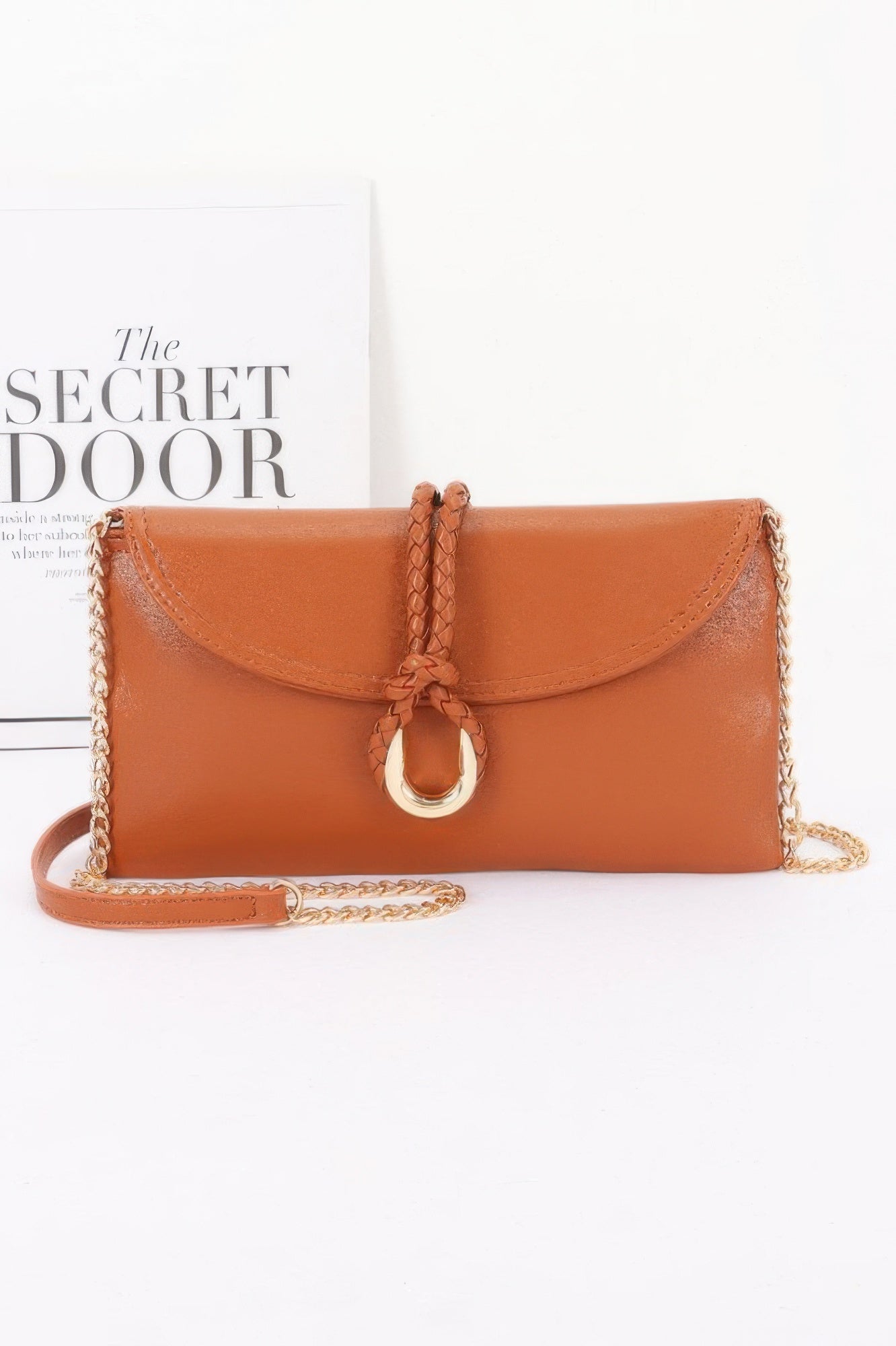 Vegan Leather Envelope Clutch Bag in tan with a gold chain strap and braided detail