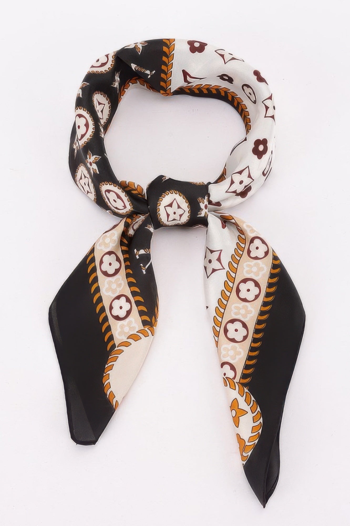 Multi Print Bandana tied in a knot, featuring black, white, and brown patterns with floral and star motifs