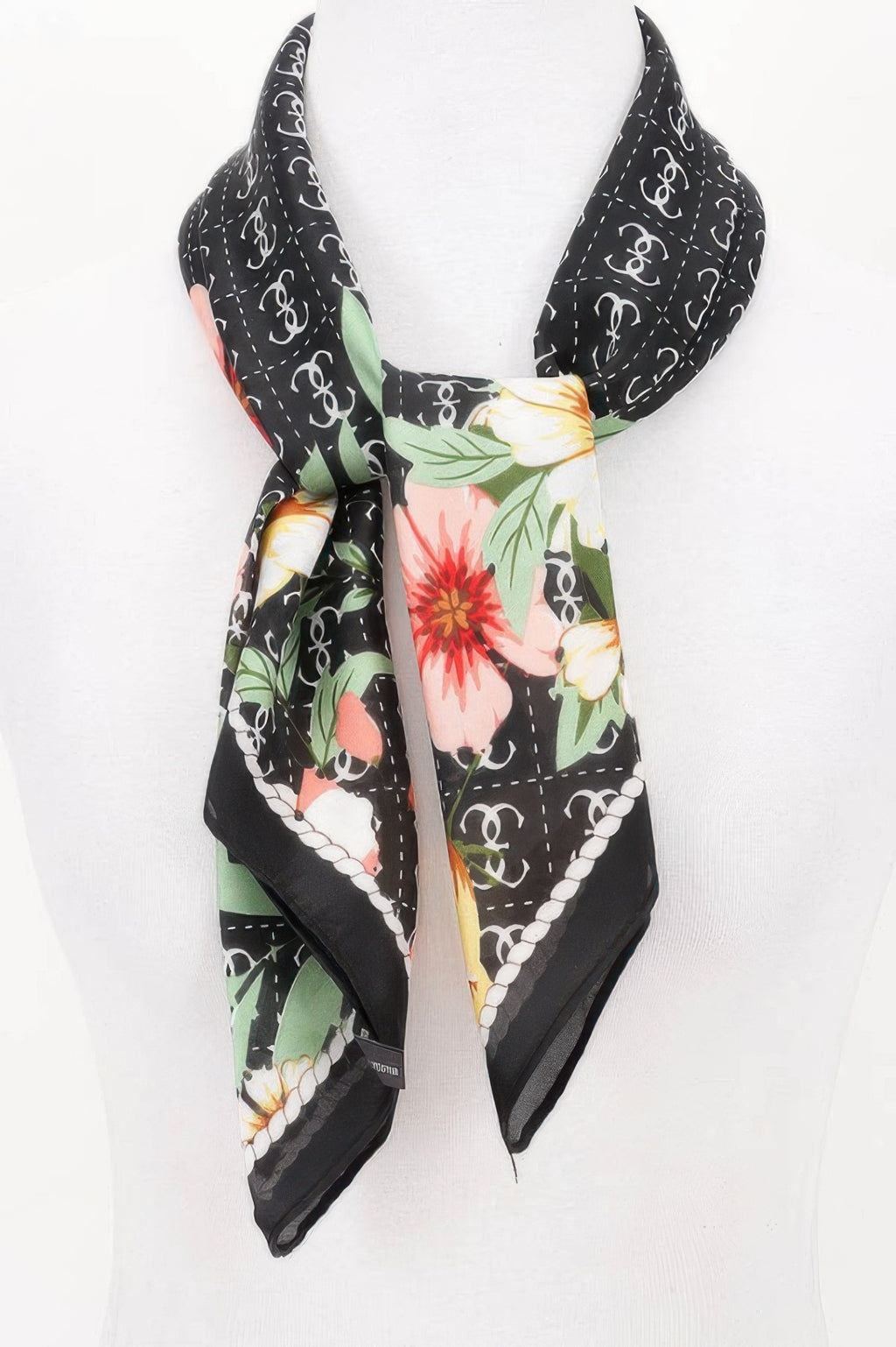 Multi Print Bandana with black background, white chain link pattern, and large pink, yellow, and green flowers