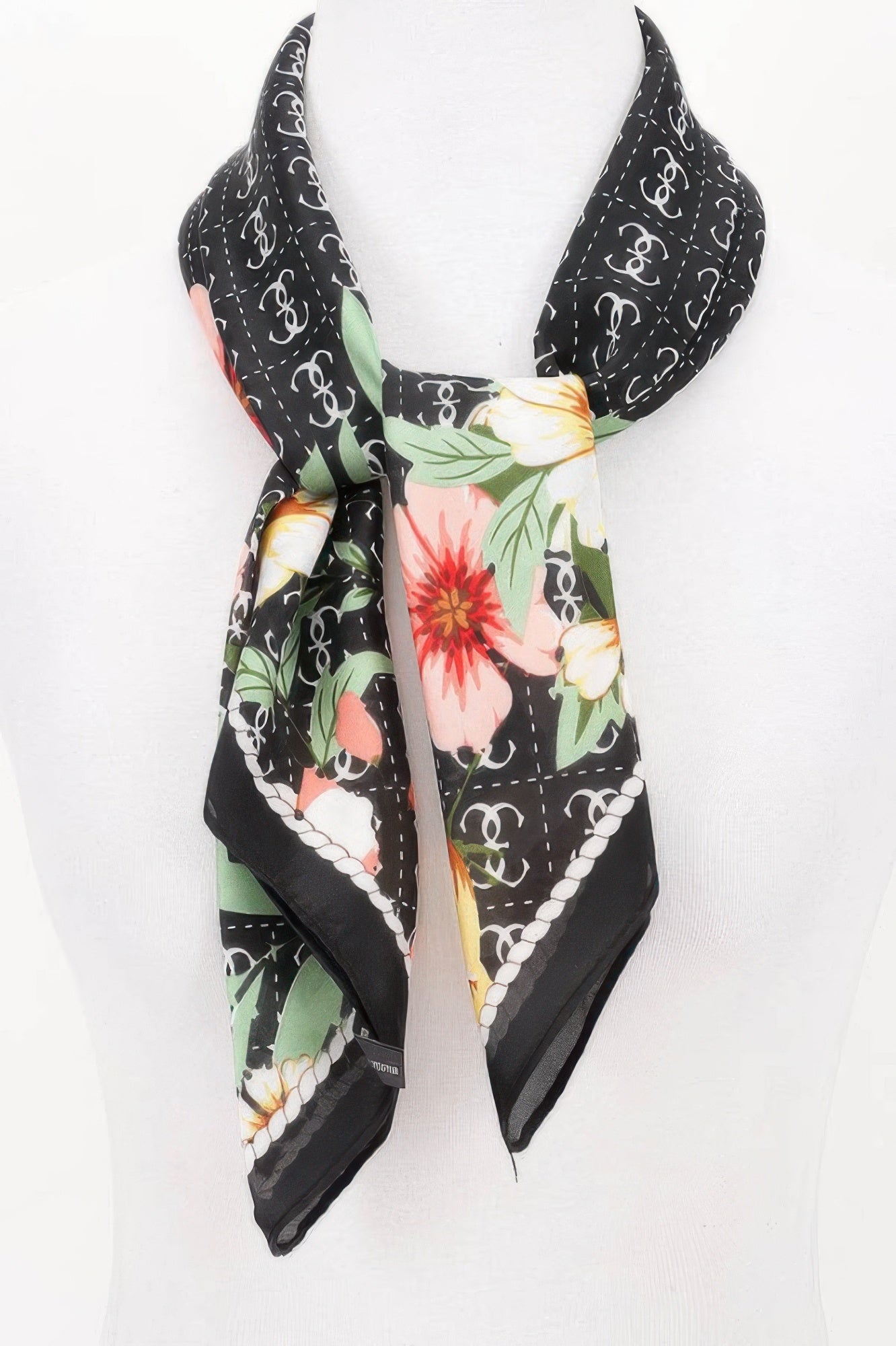 Multi Print Bandana with black background, white chain link pattern, and large pink, yellow, and green flowers