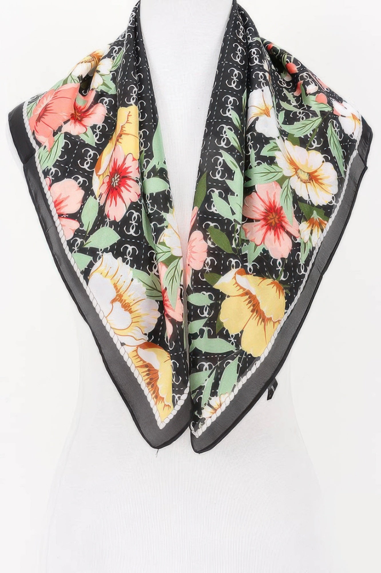 Multi Print Bandana with a black background and a floral pattern in pink, yellow, and white