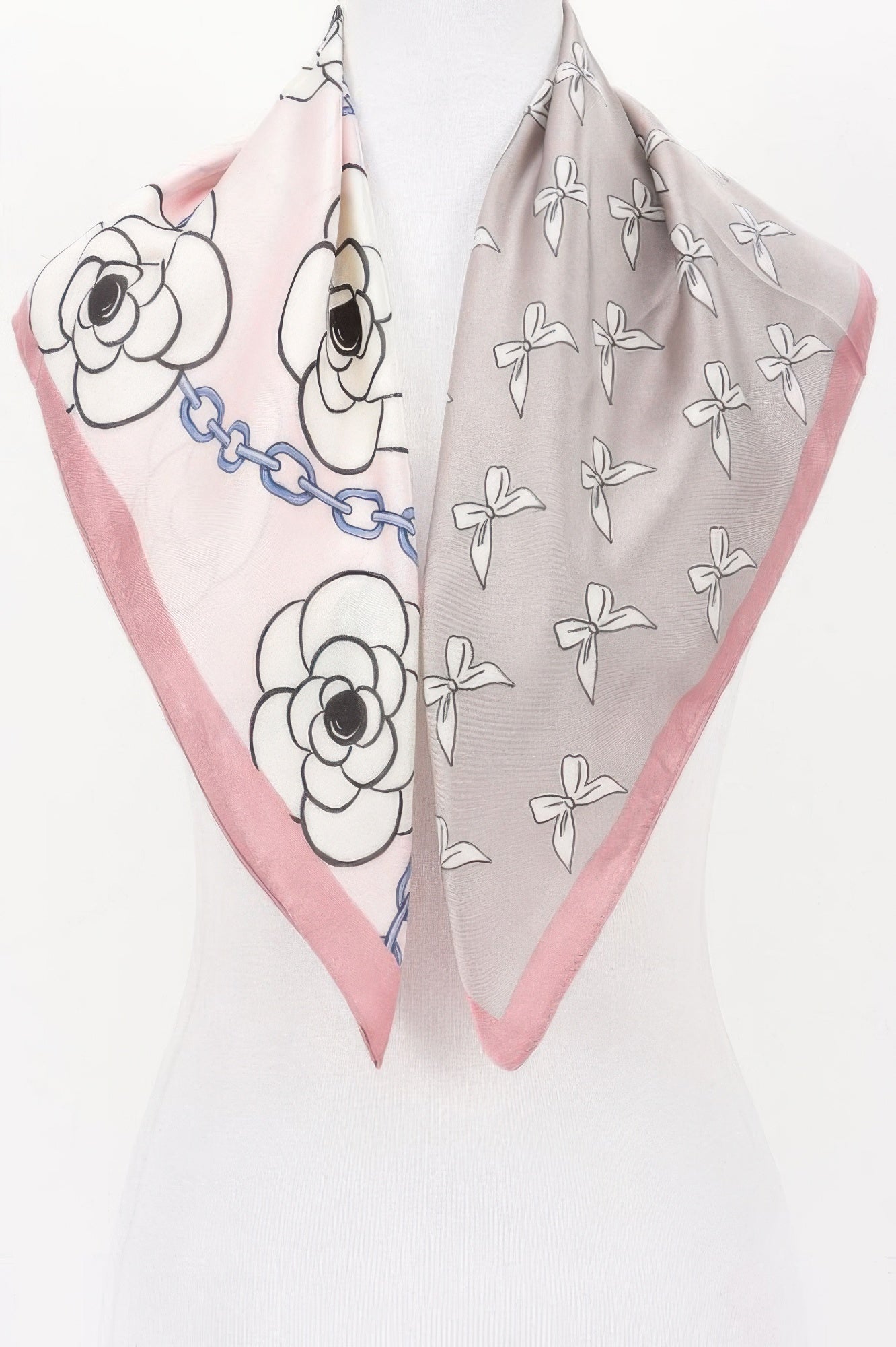Multi Print Bandana with pink and gray sides, one with flowers and chains, the other with bows