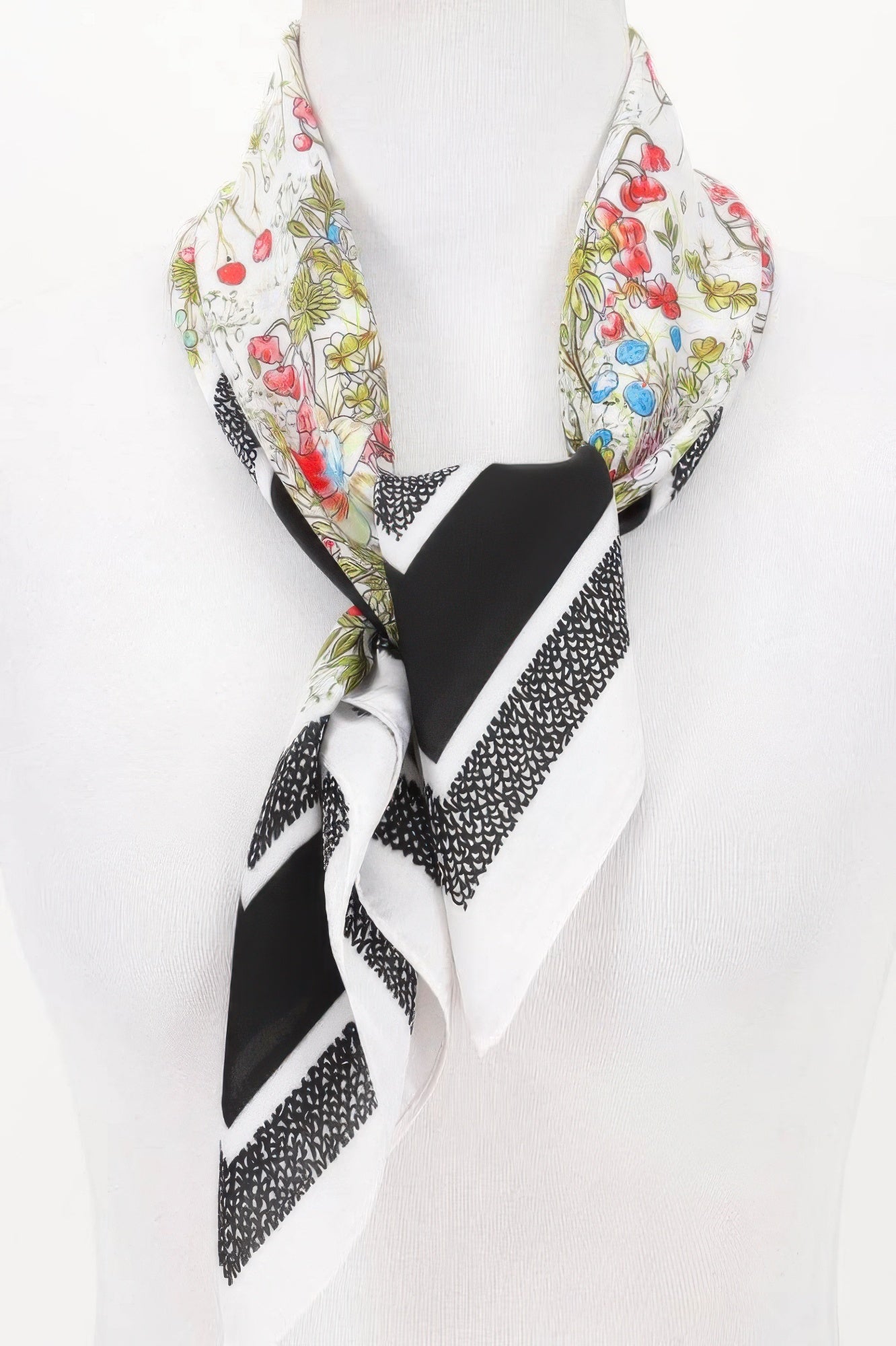 Multi Print Bandana with floral and geometric patterns tied on a white mannequin