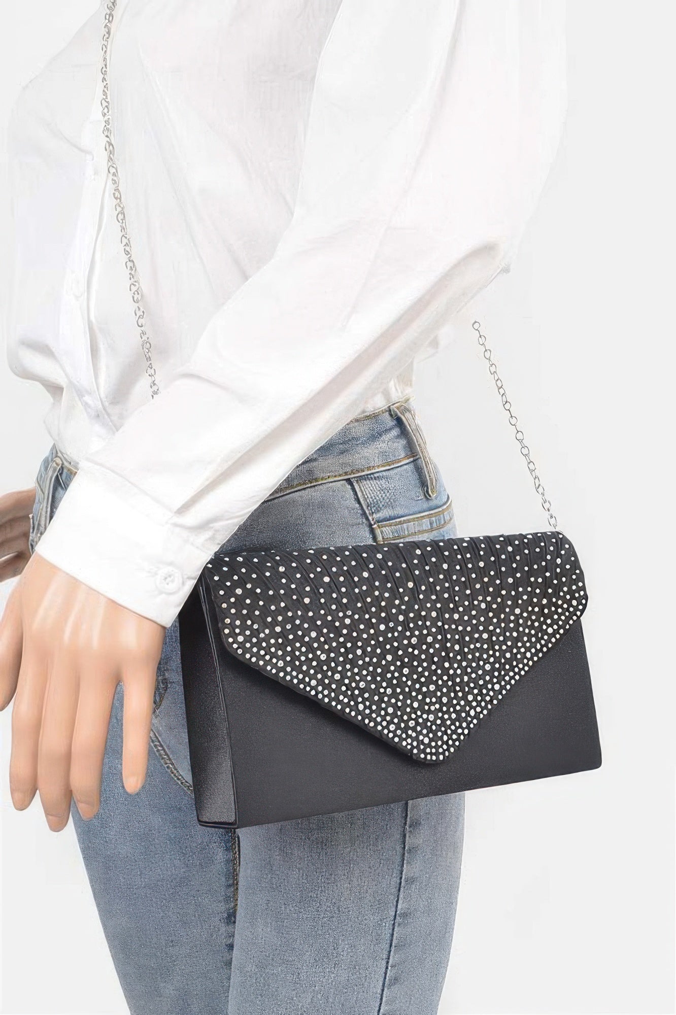 Rhinestone Satin Party Clutch in black with silver chain, worn by a person in a white shirt and jeans