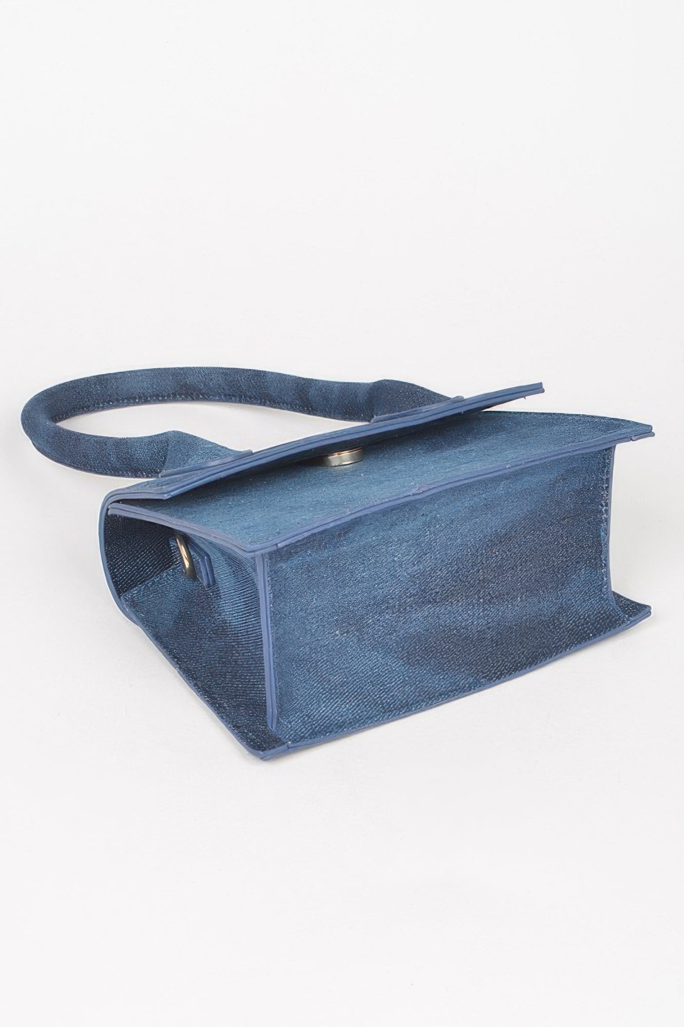 Denim Top Handle Crossbody Bag, side view, with flap closure and top handle visible