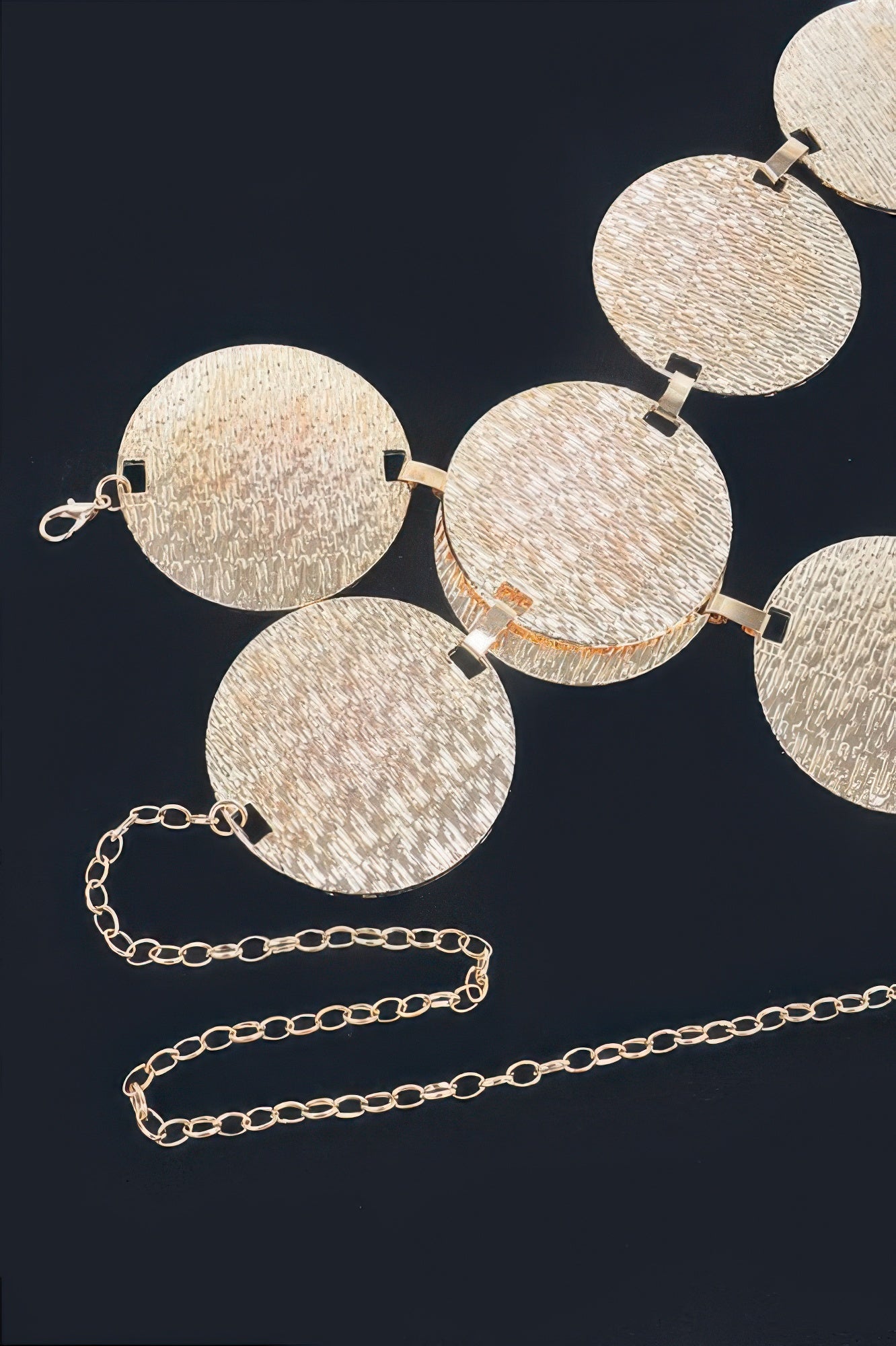 Iron Circular Plated Plus Size Belt with textured gold circular plates and a gold chain