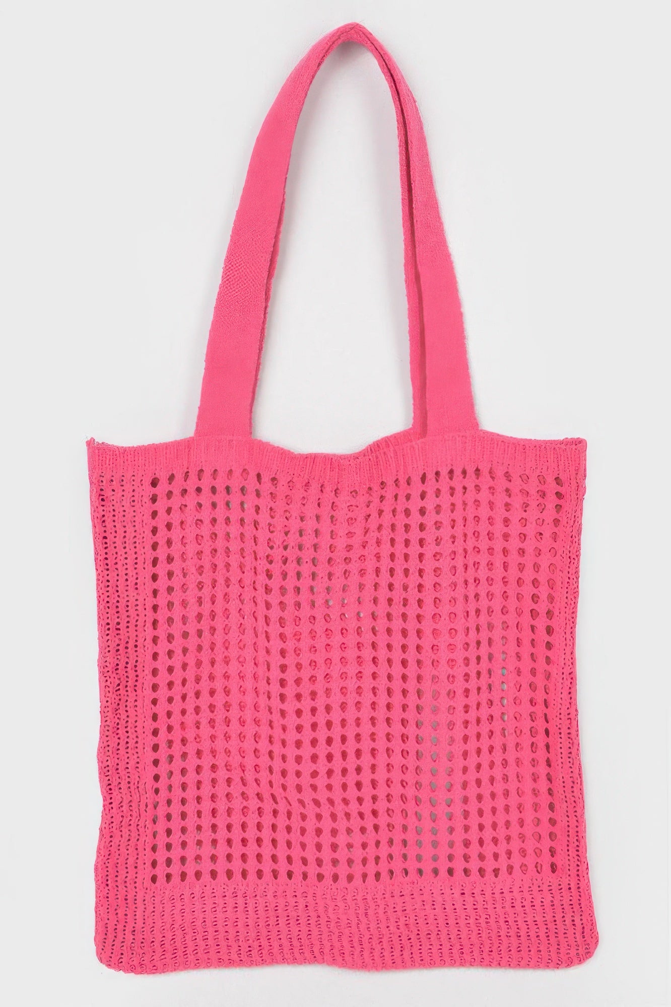 Knitted Tote Bag in a bright pink color with a mesh-like pattern