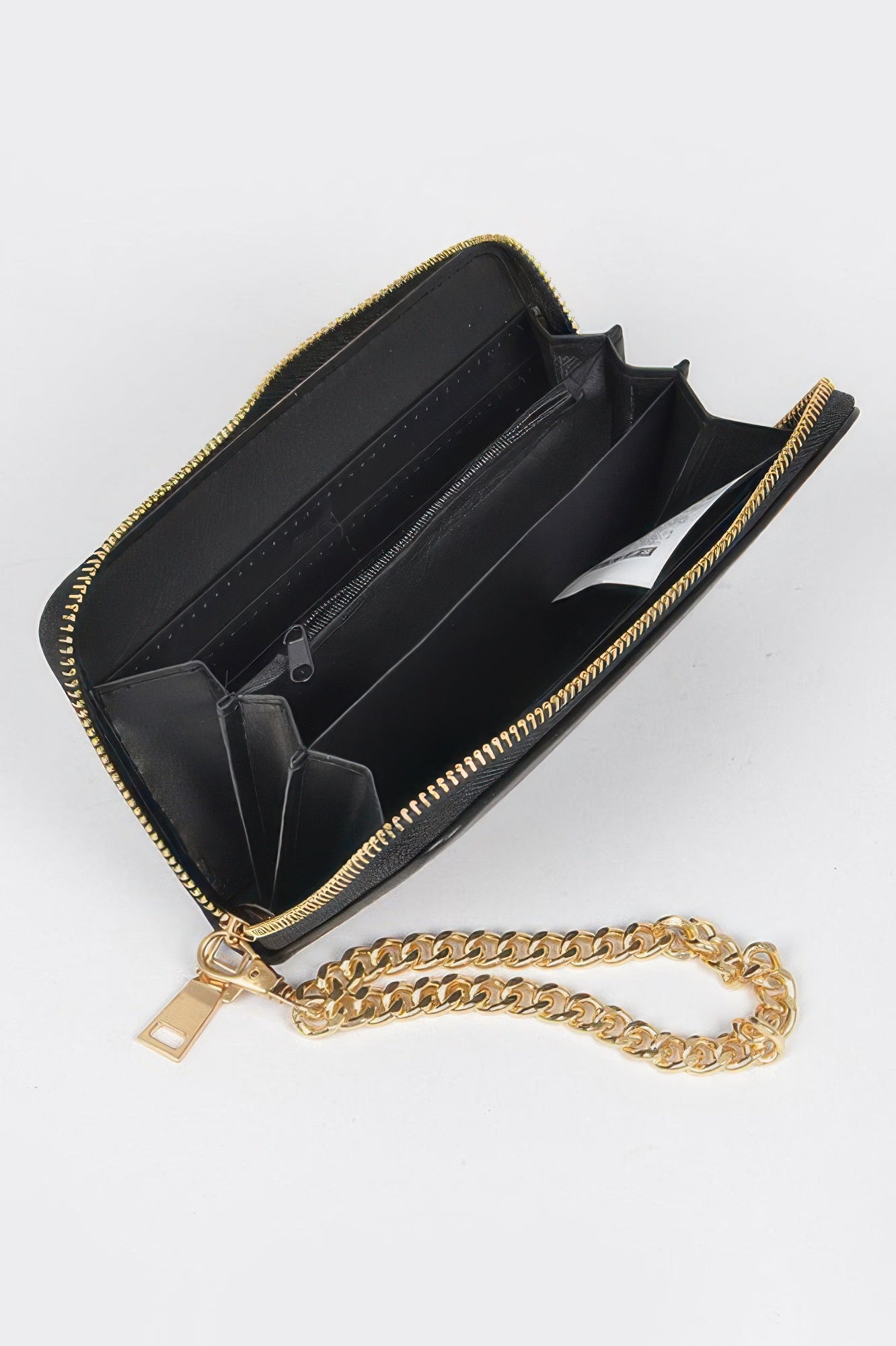 Open black studded wallet with gold chain, showing multiple compartments and a zippered section