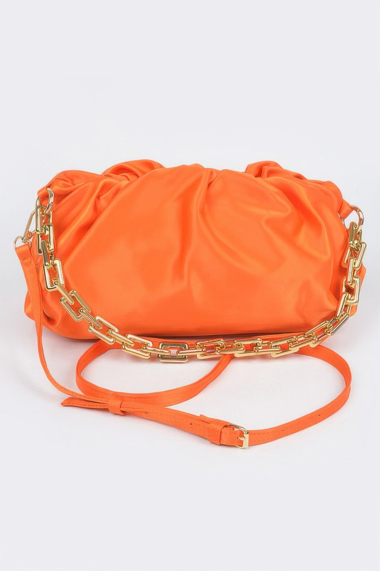Satin Chain Pouch Bag in orange with a gold chain strap and a thin adjustable shoulder strap