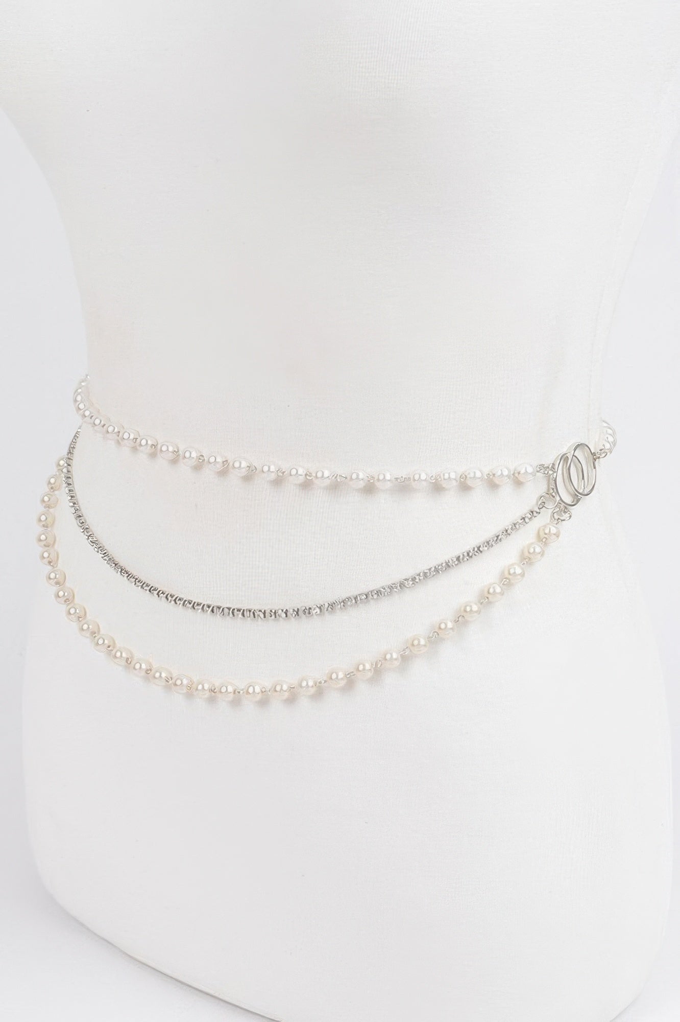 Pearl Layered Chain Belt with three strands, two with pearls and one with silver chain, on a white mannequin