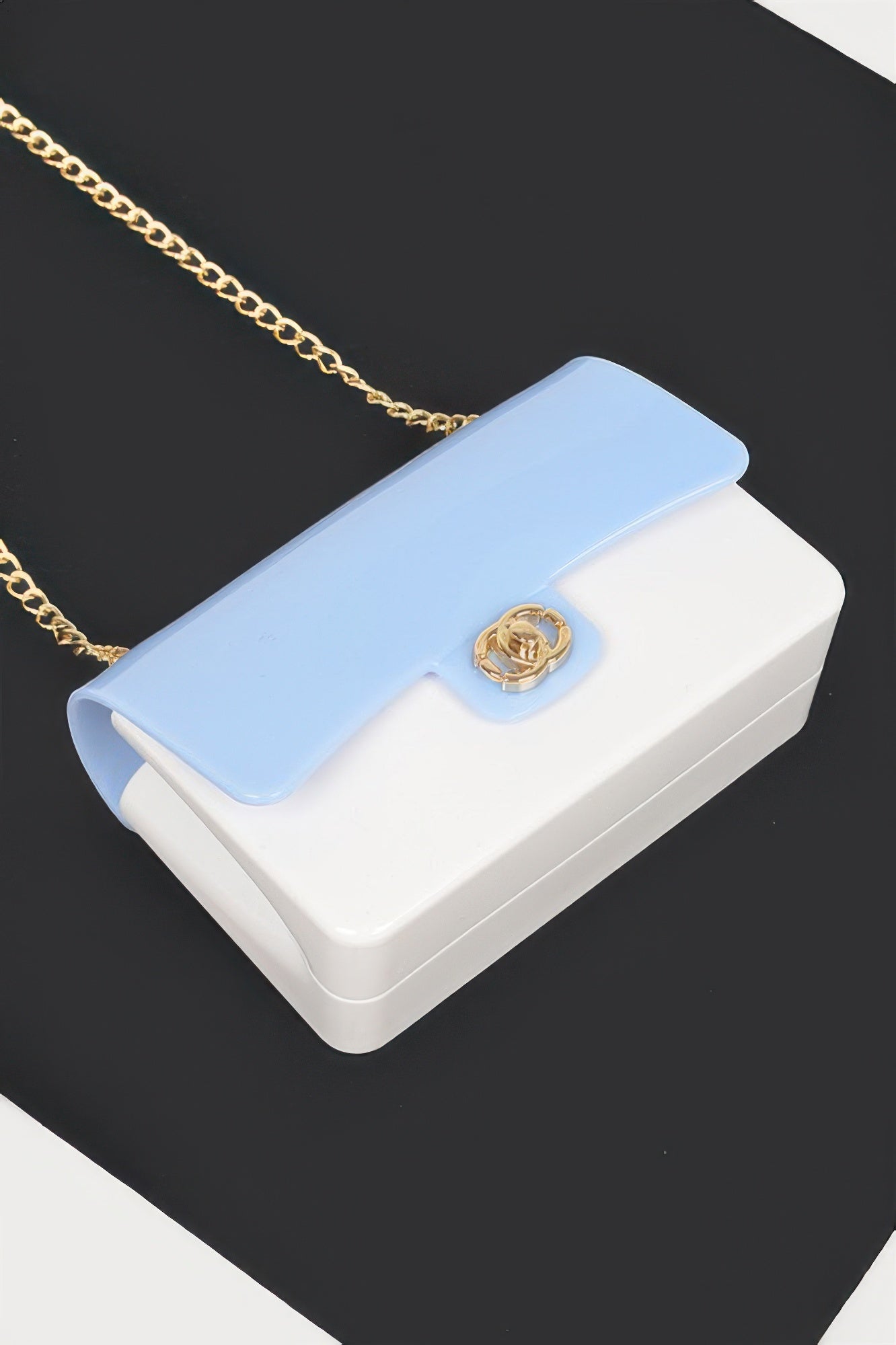 Two Toned Gold Metal Clutch in light blue and white with a gold chain strap