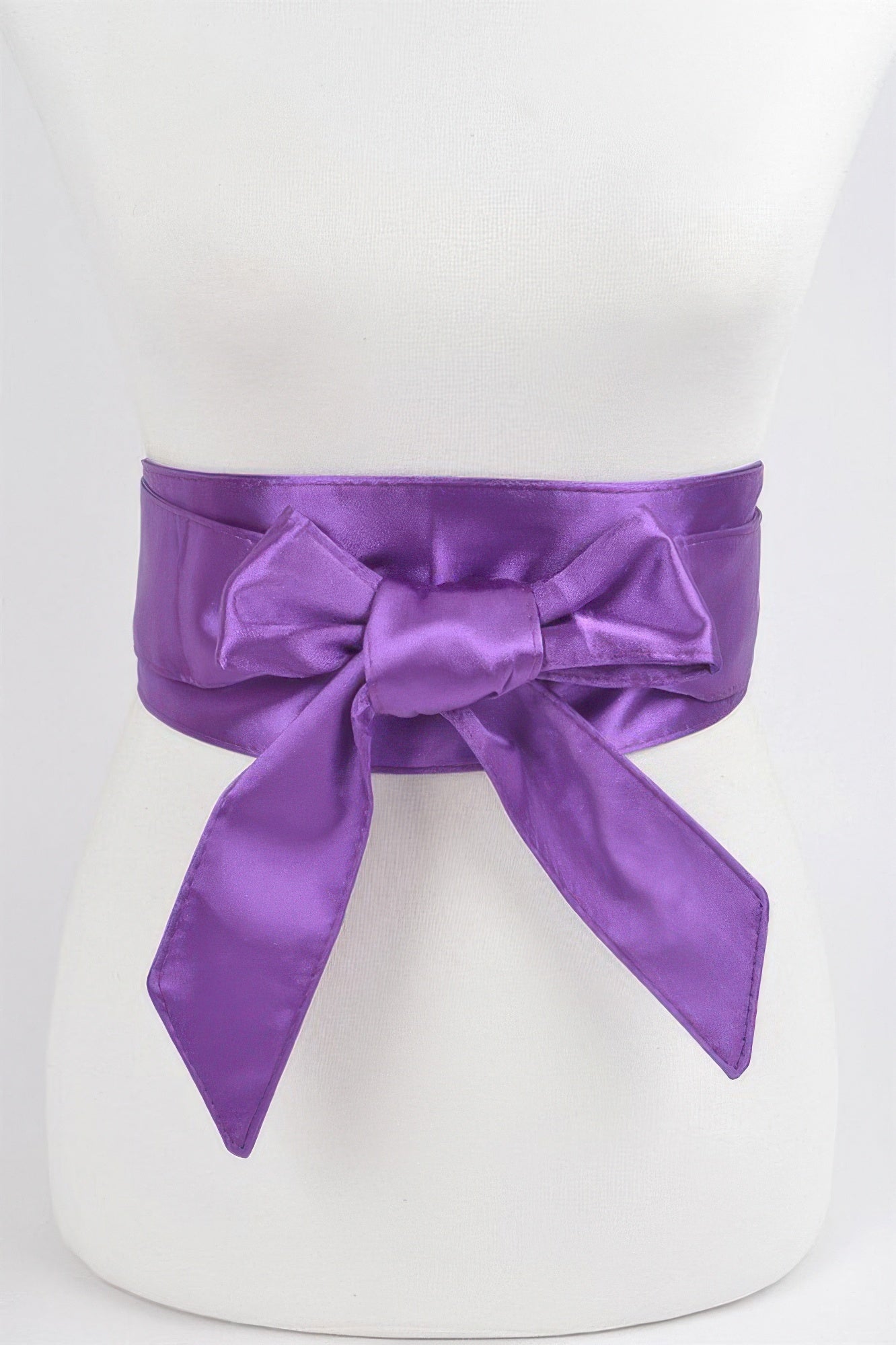 Satin Kimono Belt in purple, tied in a bow around a white mannequin's waist