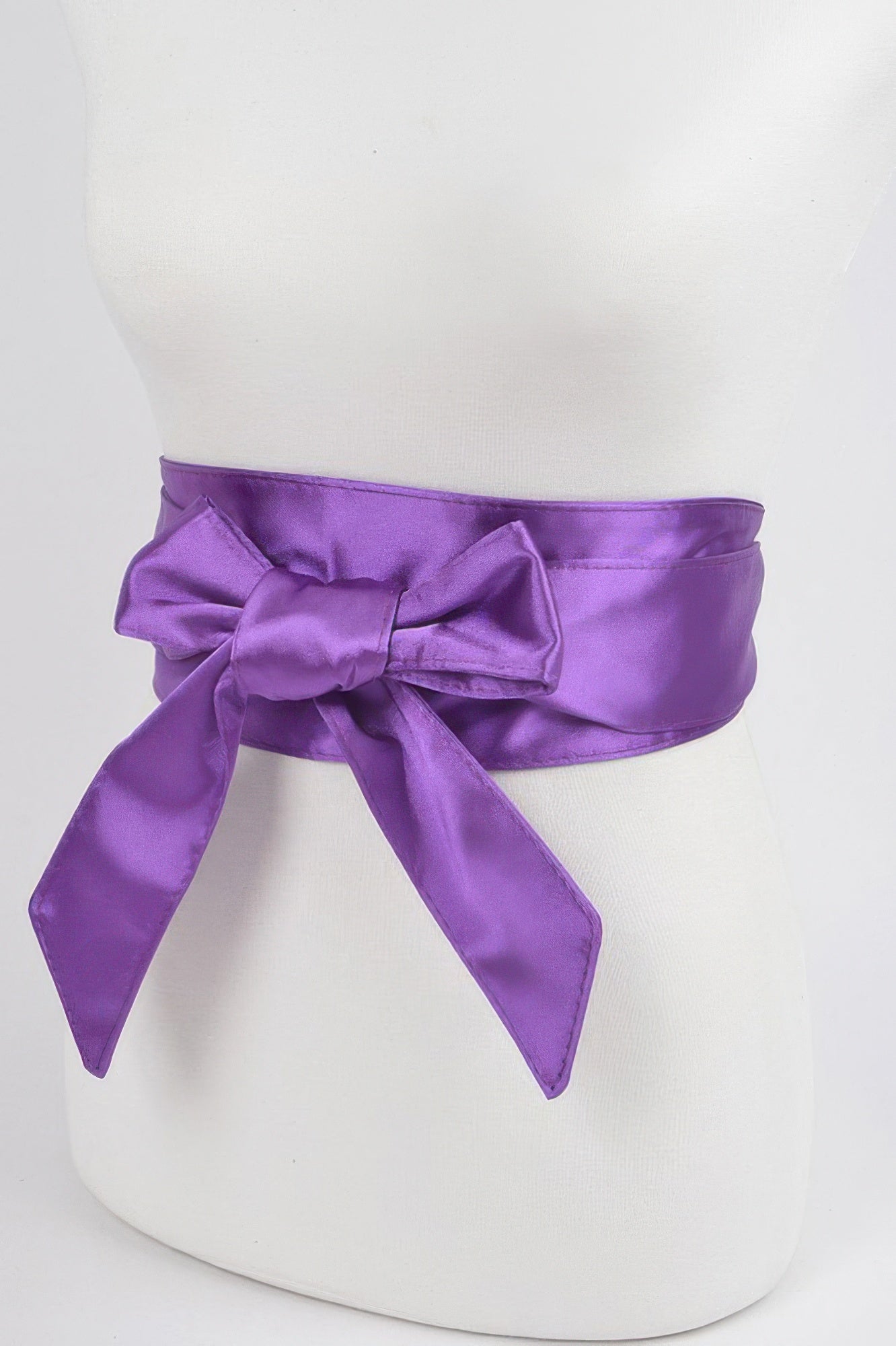 Satin Kimono Belt in purple, tied in a bow around a white mannequin's waist