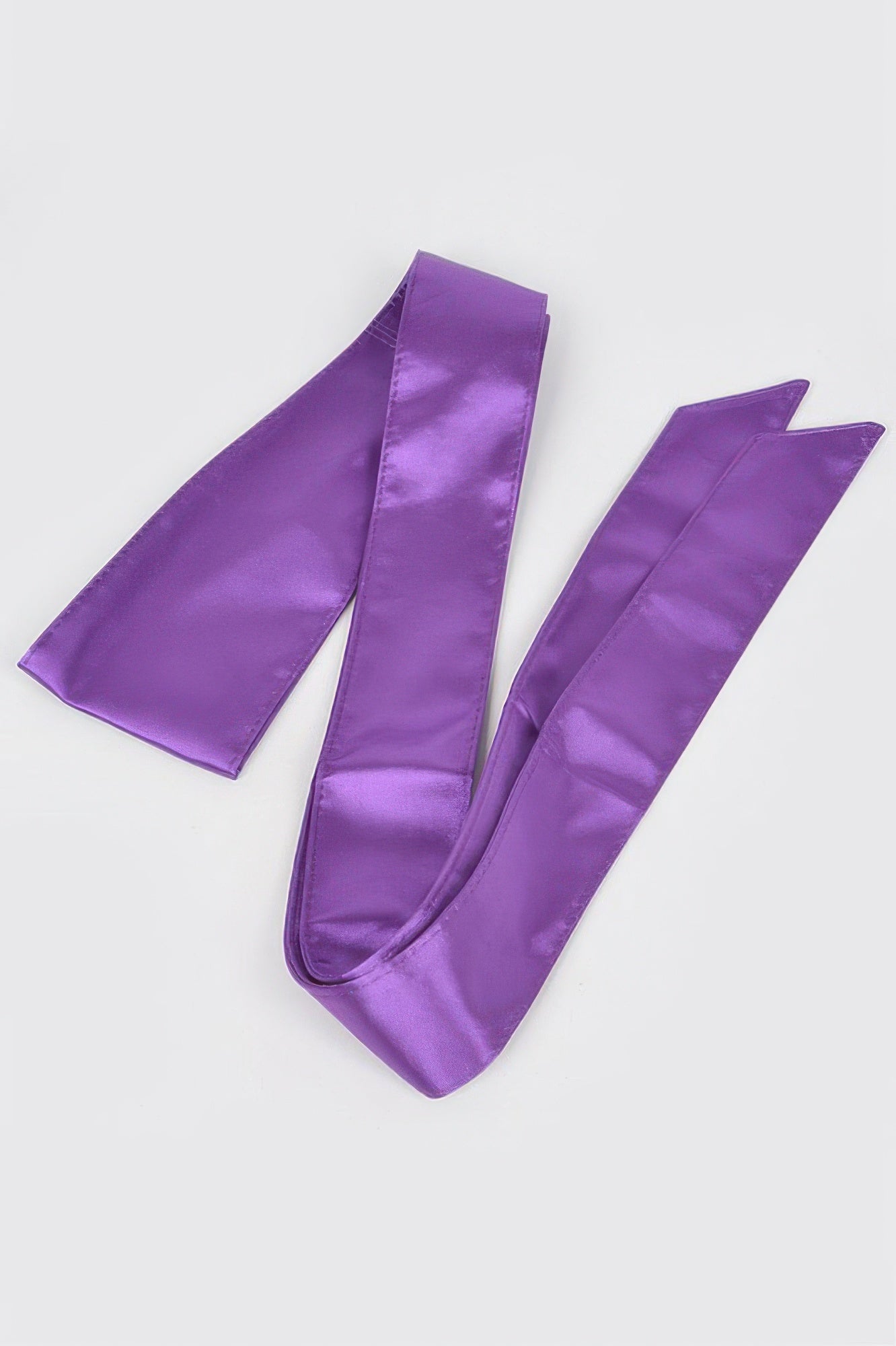 Satin Kimono Belt in purple, folded on a white background