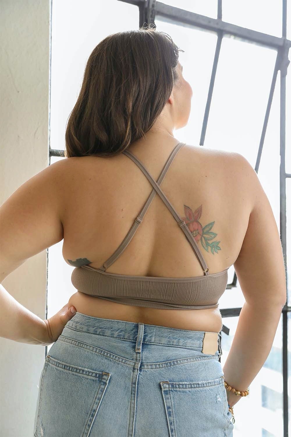 Woman from behind wearing a Crochet Lace High Neck Bralette with cross-back straps