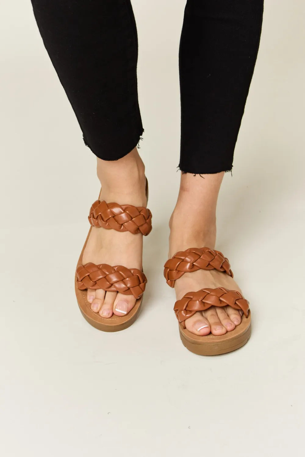 Woven Dual Band Platform Sandals in brown on a person's feet