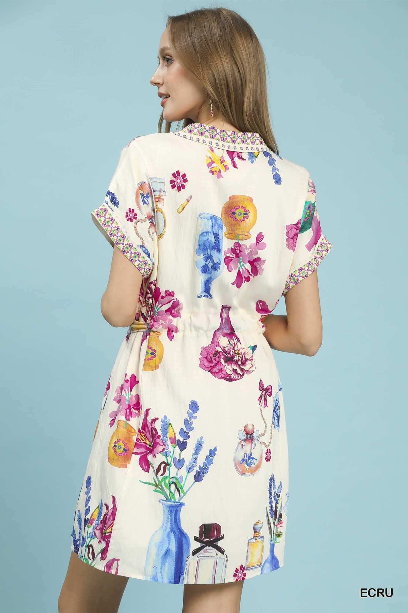Umgee Floral Print Belted Mini Dress with colorful floral and perfume bottle pattern