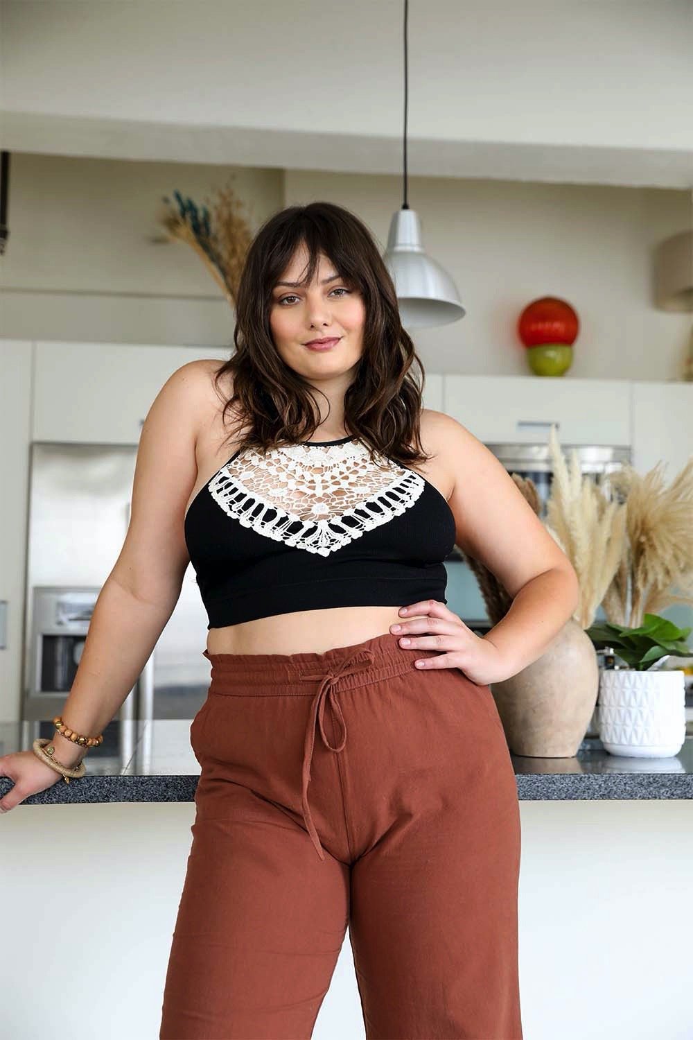 Crochet Lace High Neck Bralette, halter style with cross-back, worn by a woman with brown hair