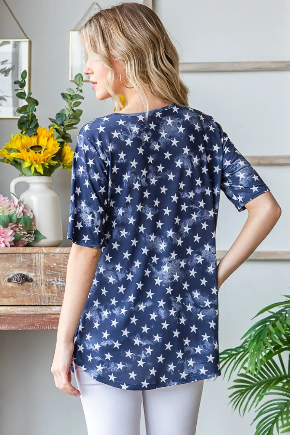 Short Sleeve Crisscross Star Babydoll Top in navy with white stars, back view