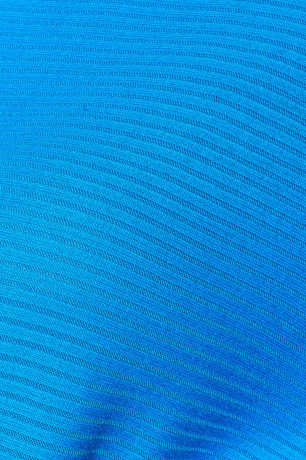 Close-up of the blue ribbed fabric of the Zenana Round Neck Batwing Sleeve Blouse