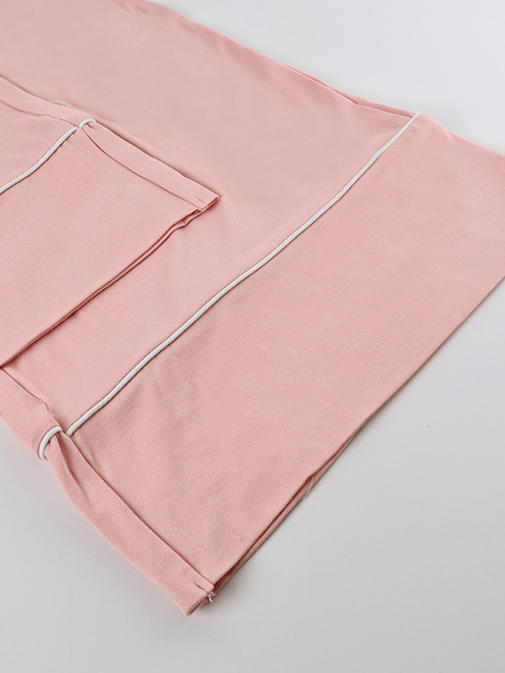 Close up of the pink Lace Trim Cami & Pants Lounge Set with white piping
