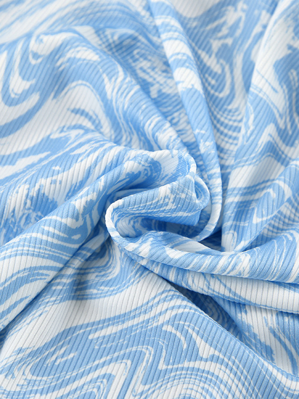 Close up of the Tie Front Long Sleeve Top and Pants Lounge Set fabric, showing blue and white swirl pattern