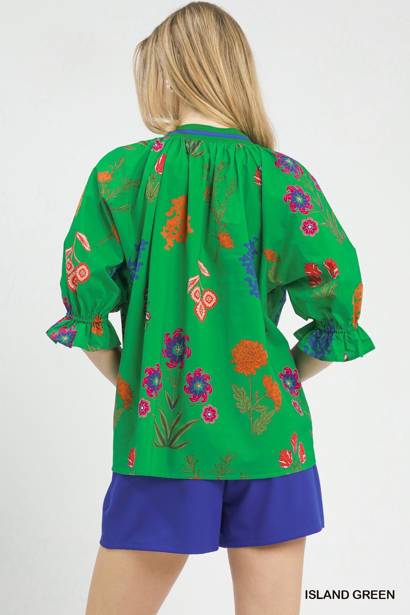Back of Floral Split Neck Puff Sleeve Top in Island Green